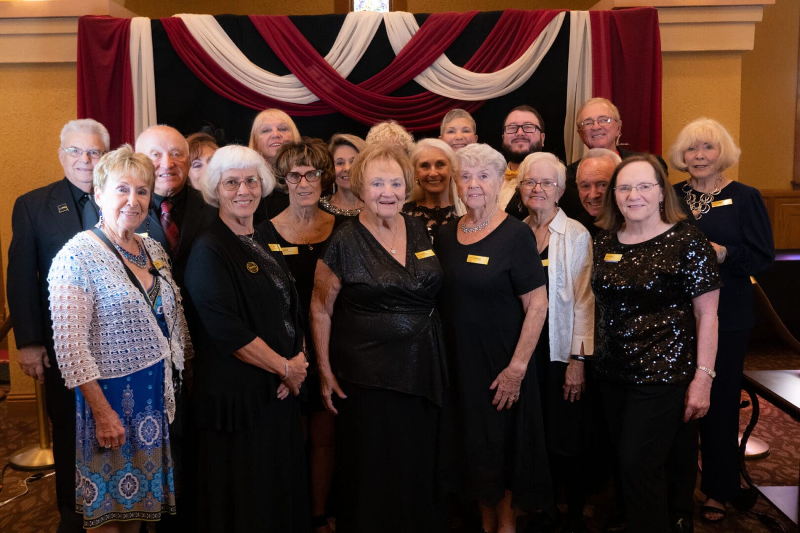 Group of smiling older adults at formal event